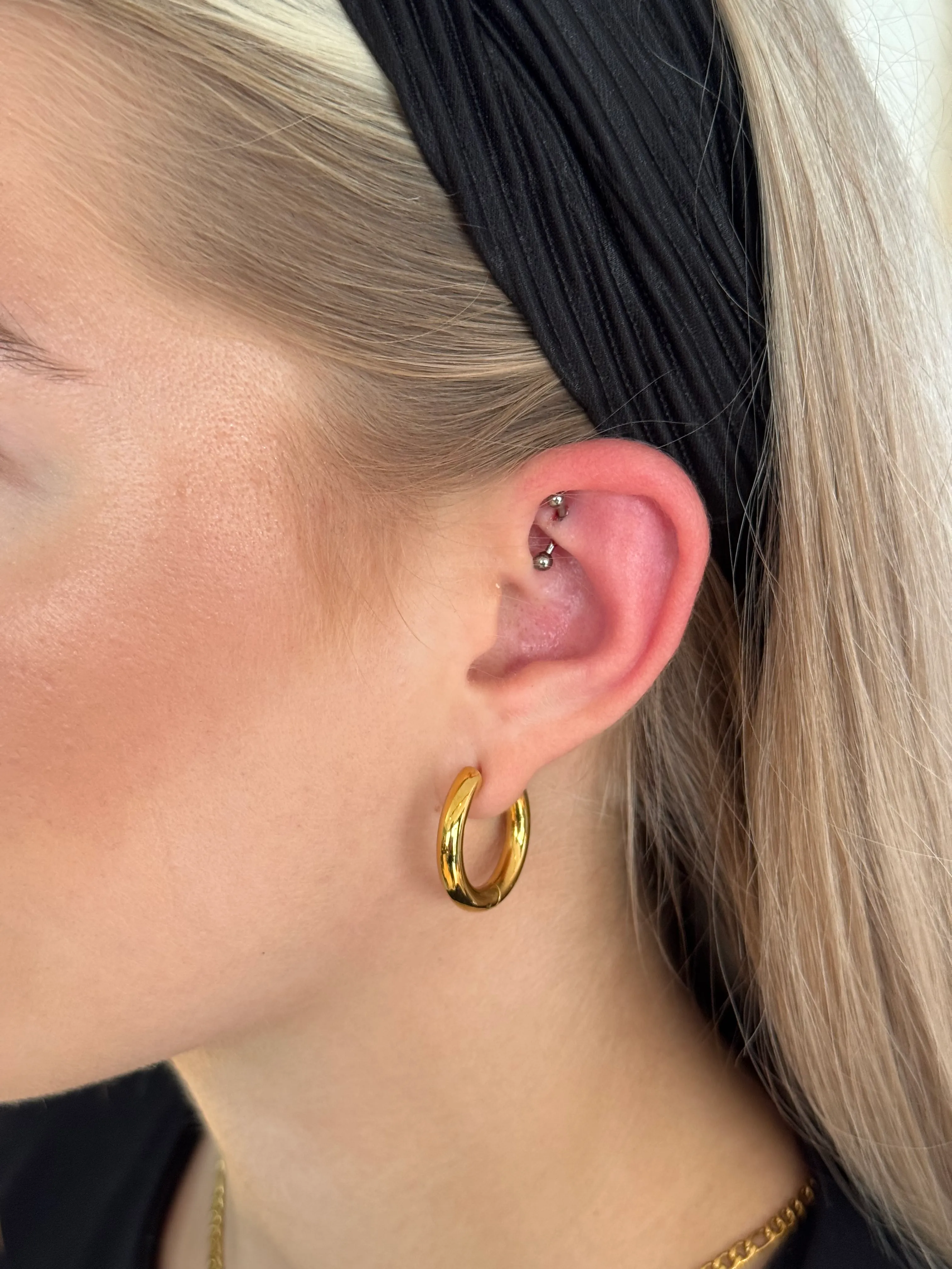 Piercing — piercing 04 lobe trio
